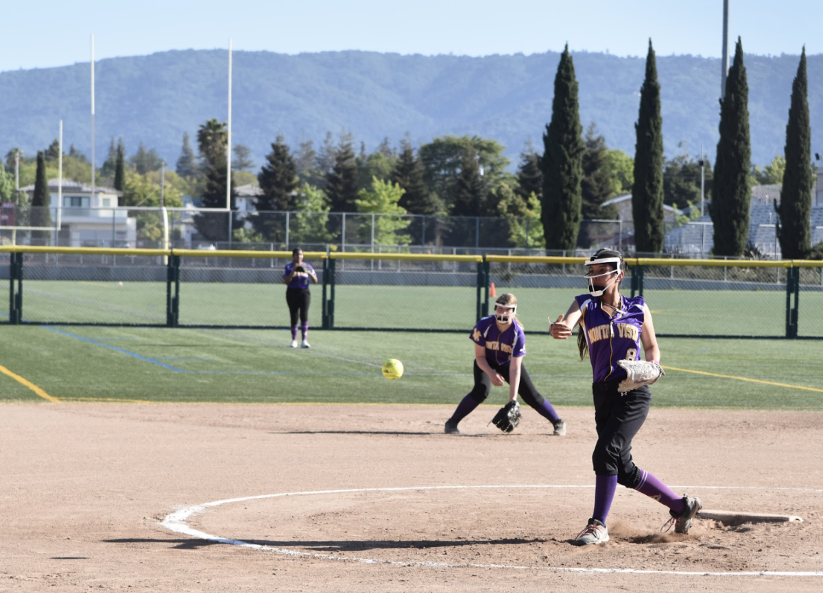 Sophomore Luciana Gonzalez throws an underhand ball toward the batter | Photo by Arshiya Sen